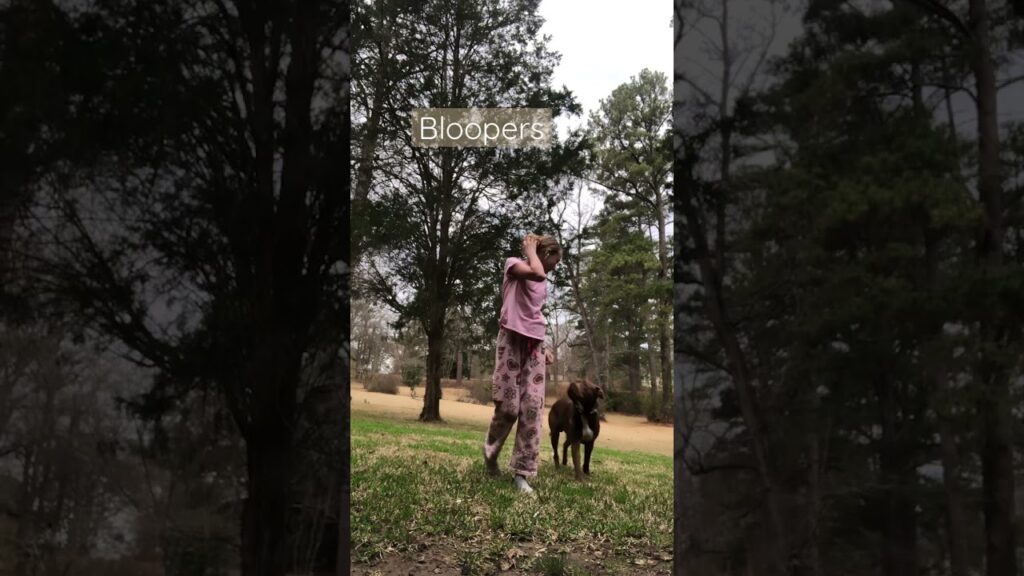 A person in pink pajamas covers their face playfully while standing on grass with a brown dog beside them. Tall trees fill the background. The word "Bloopers" is overlaid on the image.